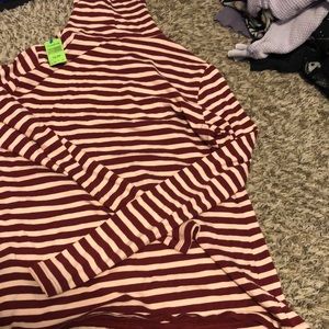 This is a long sleeve red and white turtle neck
